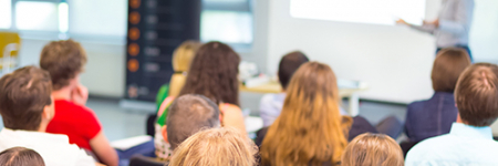 A group of people in a lecture room