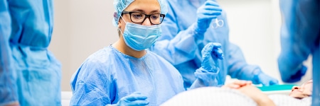 Doctor about to begin operation on a pregnant woman in surgery