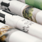 A pile of folded newspapers