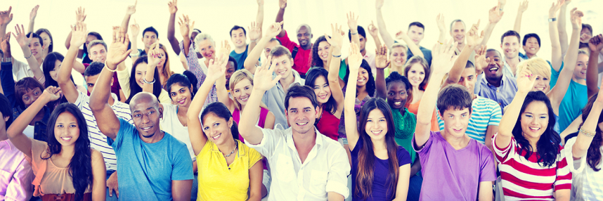 A group of people with their hands raised