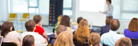 A group of people listening to a presentation.