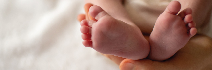 The underside of a newborn baby's feet, showing the heels.