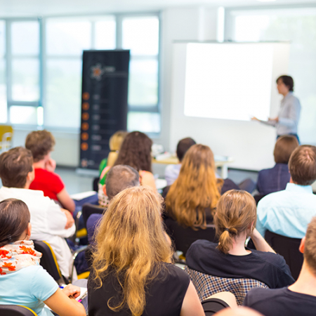 A group of people in a lecture room