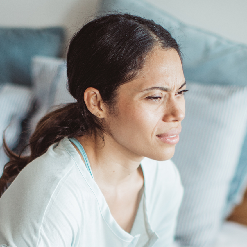 Young woman with pained expression