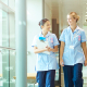 A group of nurses walking through a hospital