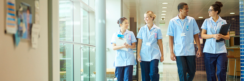 A group of nurses walking through a hospital