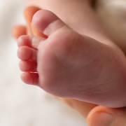 The underside of a newborn baby's feet, showing the heels.